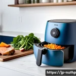뇌 건강을 위한 조리법  에어프라이어 활용 - A modern Japanese kitchen scene featuring a sleek air fryer on the countertop, surrounded by fresh b...